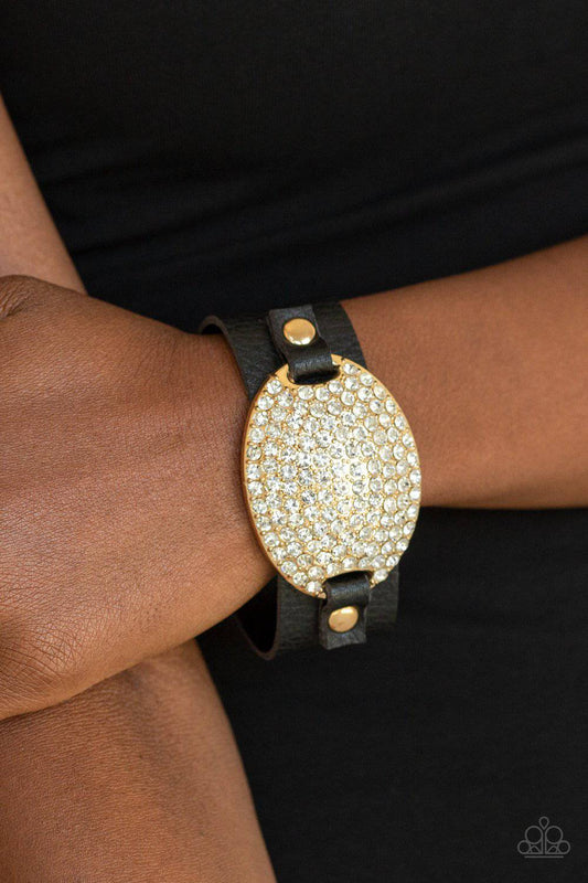 Better Recognize - Gold Rhinestone Black Leather Bracelet - Paparazzi Accessories - GlaMarous Titi Jewels