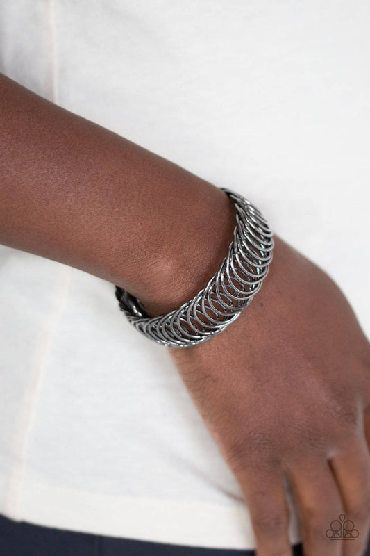 Dizzyingly Demure - Black Flexible Cuff Bracelet - Paparazzi Accessories - GlaMarous Titi Jewels