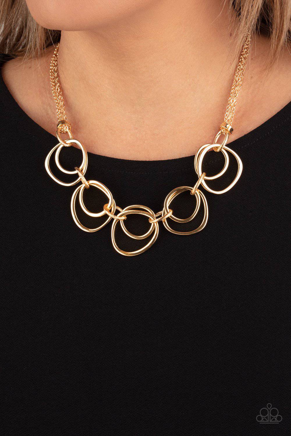 Asymmetrical Adornment - Gold Rings Necklace - Paparazzi Accessories - GlaMarous Titi Jewels