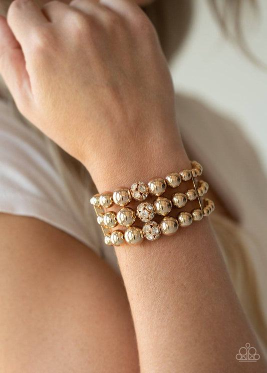 Icing On The Top - Gold and Rhinestone Stretchy Bracelet - Paparazzi Accessories - GlaMarous Titi Jewels