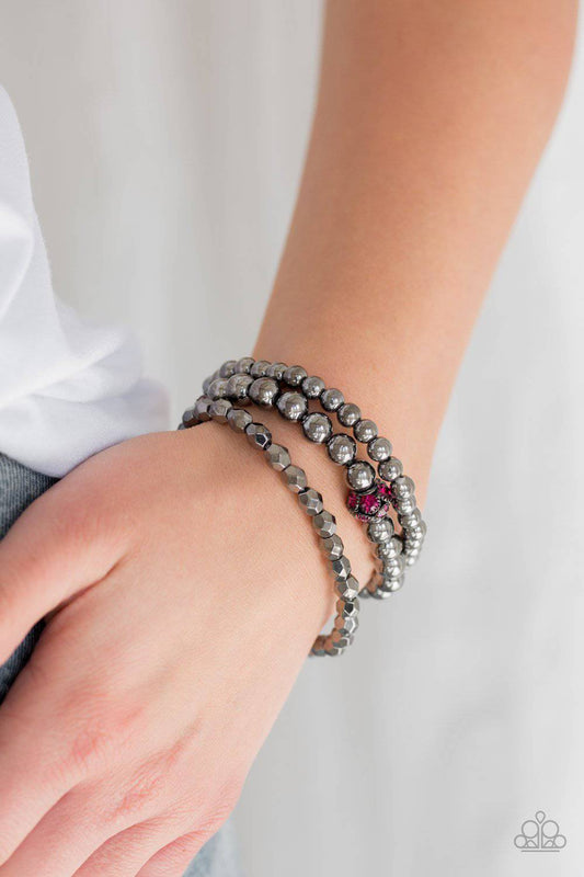 Noticeably Noir - Pink Rhinestone and Gunmetal Stretchy Bracelet - Paparazzi Accessories - GlaMarous Titi Jewels