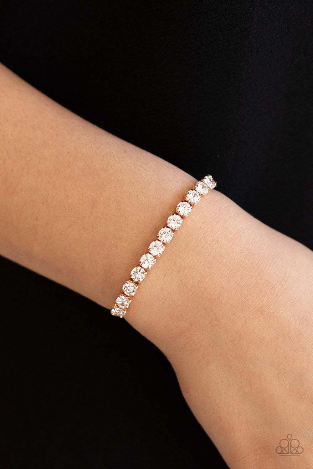 Red Carpet Rival - Gold and Rhinestone Bracelet - Paparazzi Accessories - GlaMarous Titi Jewels