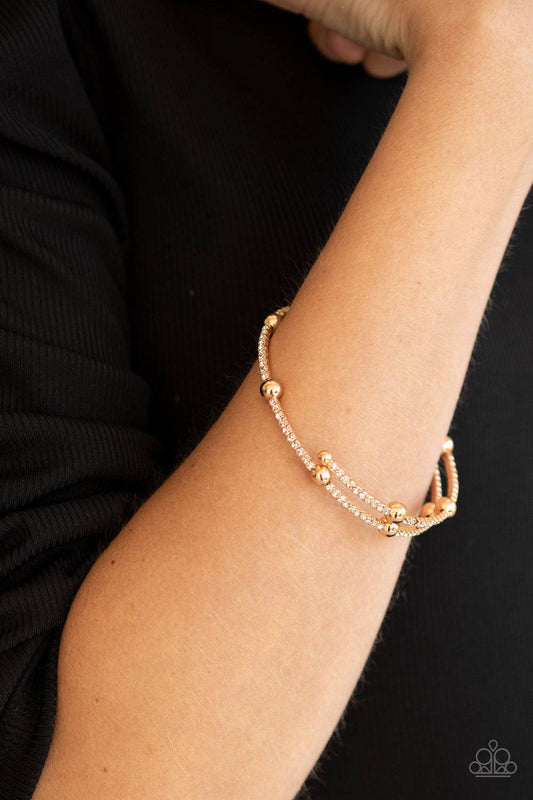 Standout Shimmer - Gold and Rhinestone Coil Bracelet - Paparazzi Accessories - GlaMarous Titi Jewels